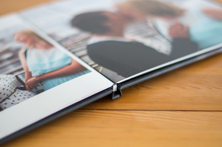 Blue Photoraphy's products: The hinged press-printed album is a lovely (and more affordable) way to share your prized photographs. They're perfect for wedding reception books or parent albums!